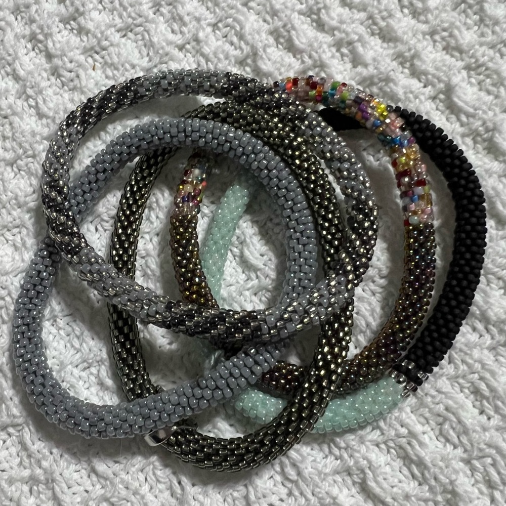 5 Sashka Co handcrafted beaded bracelets. Dark gray with accents. Approx 8”.